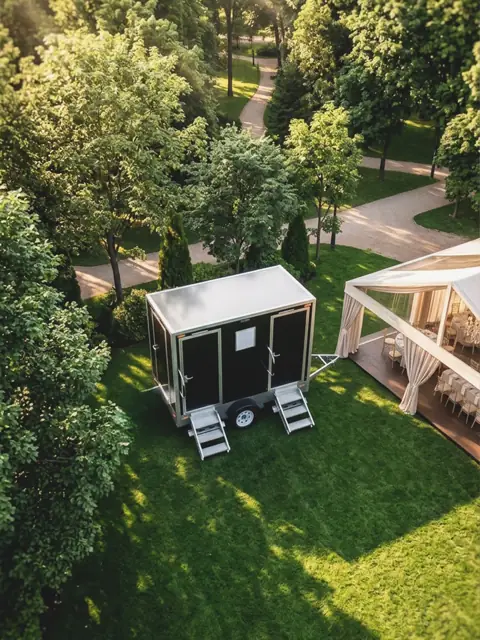 Restroom trailer on a lawn for a wedding